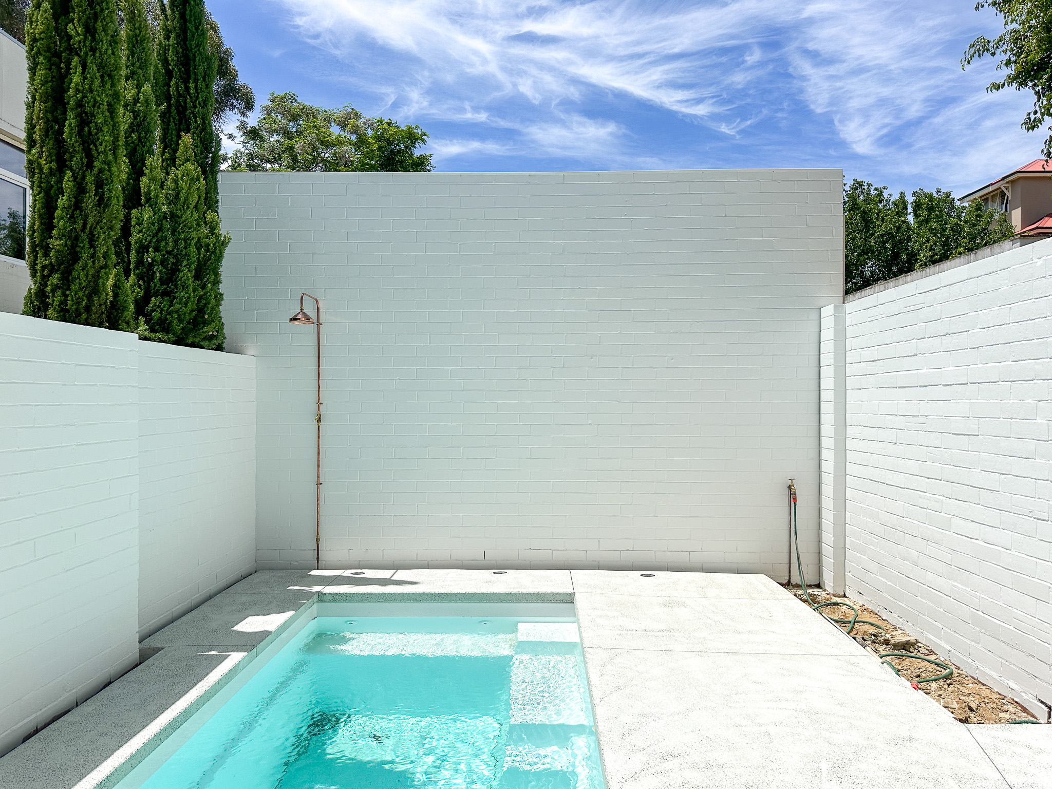 outdoor pool area brick wall painting Perth